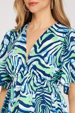 Load image into Gallery viewer, Women’s Printed Chiffon Blouse – Deep V-Neck Smocked Empire Waist Top with Flutter Sleeves